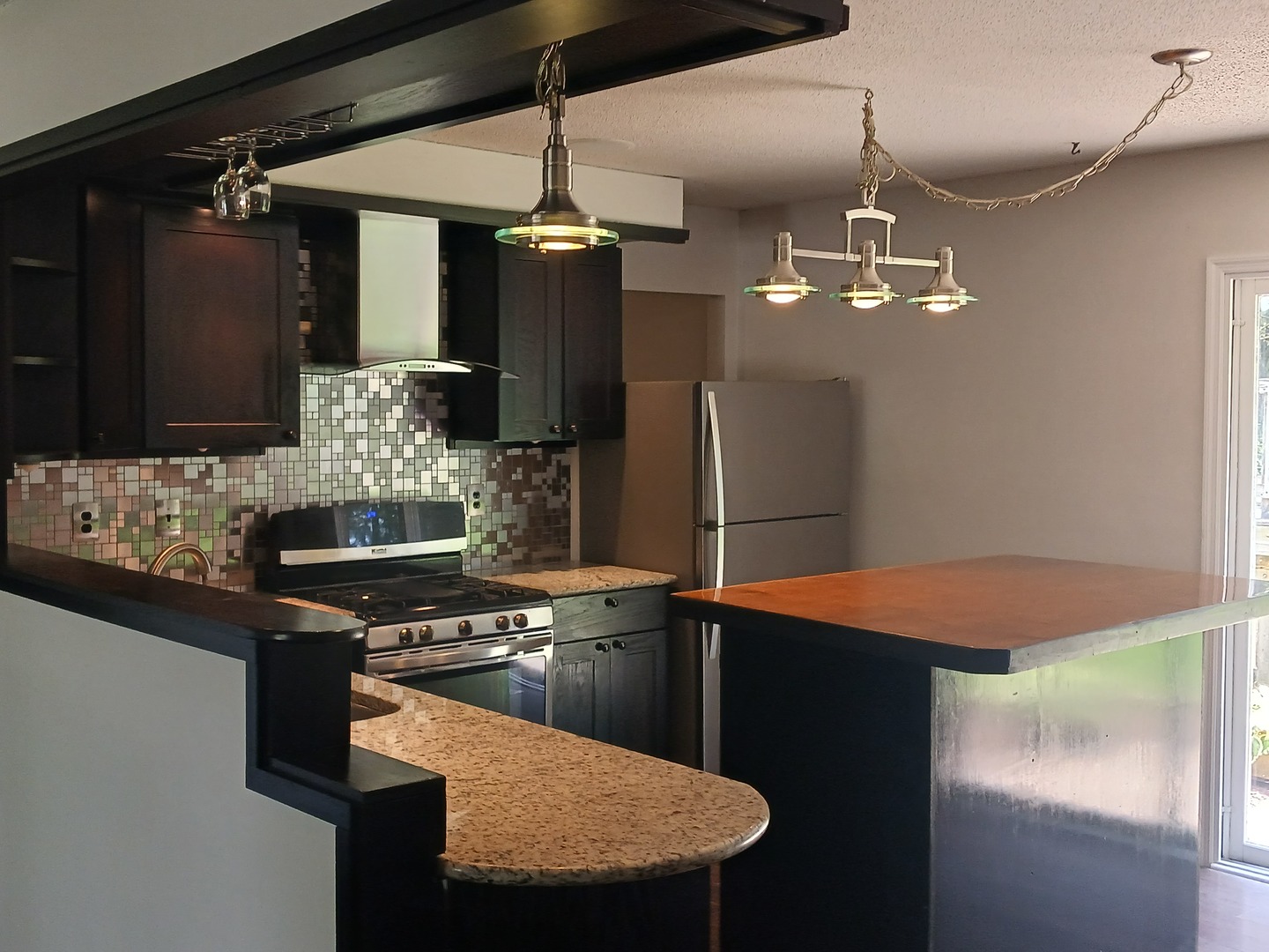 9 Southview Drive Sidney, IL 61877 - Photo 5 of 21 a kitchen with stainless steel appliances kitchen island granite countertop cabinets and refrigerator