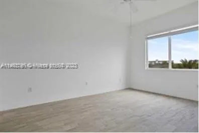 a view of a room that has a window in it