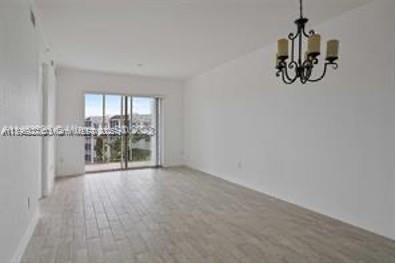 3600 Oaks Clubhouse Drive, Unit 509 Pompano Beach, FL 33069 - Photo 20 of 22 wooden floor in an empty room