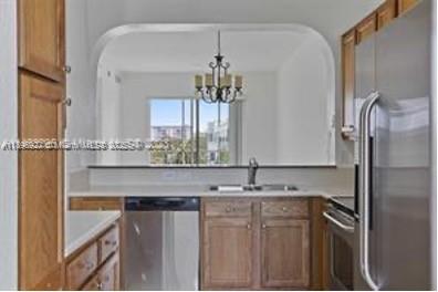 3600 Oaks Clubhouse Drive, Unit 509 Pompano Beach, FL 33069 - Photo 21 of 22 a bathroom with a sink vanity granite and a mirror