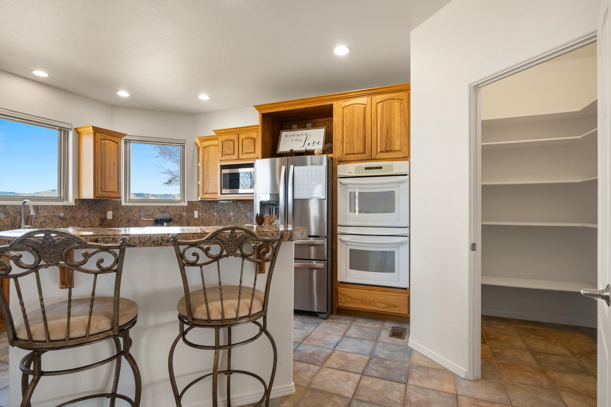 2107 I I- 1/2 Road Grand Junction, CO 81505 - Photo 11 of 42 a kitchen with lots of counter top space cabinets and appliances