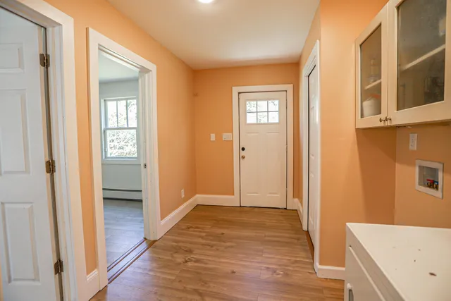a view of a bathroom with sink and wooden floor