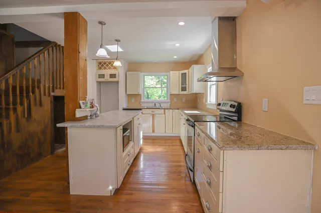 a kitchen with a sink and cabinets