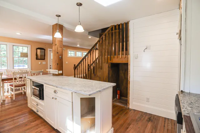 a kitchen with a stove a sink and a refrigerator