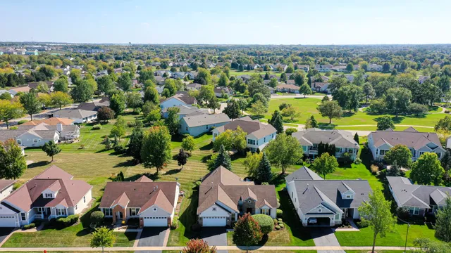 an aerial view of house with yard