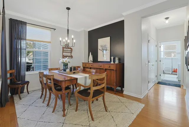 a view of a dining room with furniture window and wooden floor