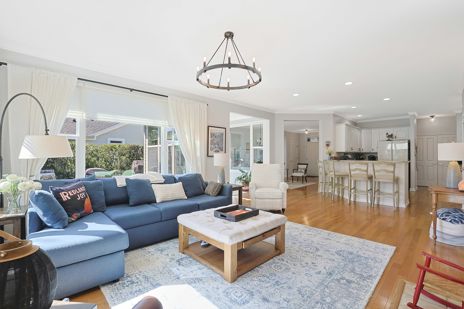 12961 West Bull Ridge Drive Huntley, IL 60142 - Photo 18 of 35 a living room with furniture a table and a large window