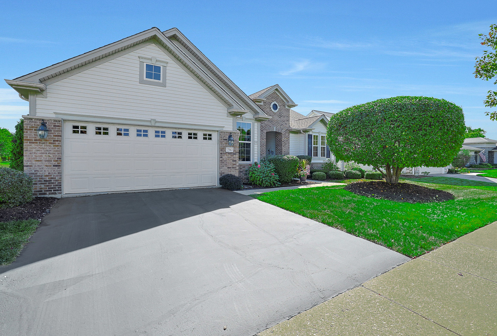 12961 West Bull Ridge Drive Huntley, IL 60142 - Photo 2 of 35 a view of a house with a yard and garage