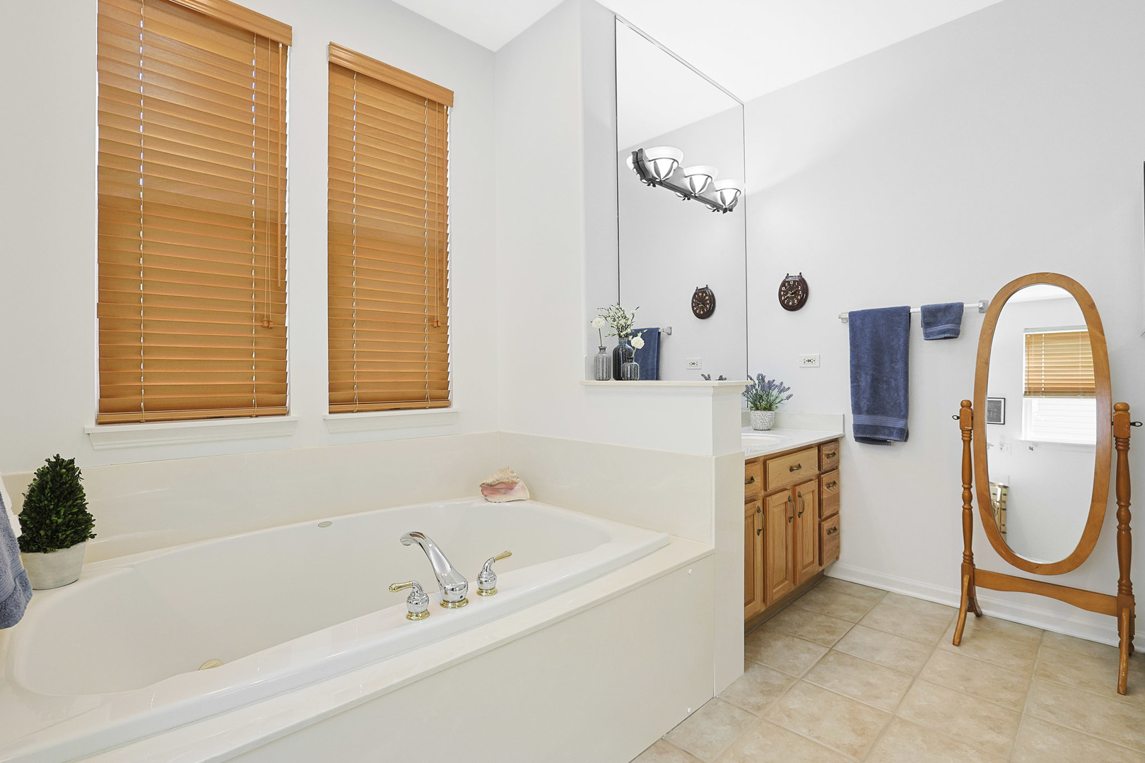 12961 West Bull Ridge Drive Huntley, IL 60142 - Photo 30 of 35 a bathroom with a bathtub and a shower