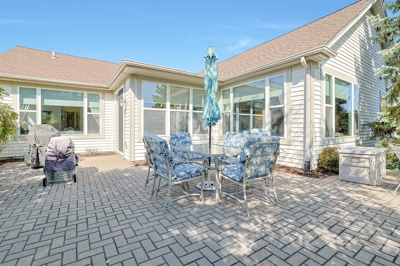 12961 West Bull Ridge Drive Huntley, IL 60142 - Photo 5 of 35 a view of a patio with table and chairs and potted plants