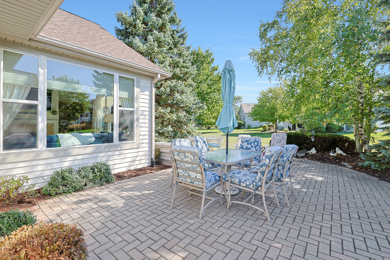 12961 West Bull Ridge Drive Huntley, IL 60142 - Photo 6 of 35 a view of a patio with table and chairs and potted plants