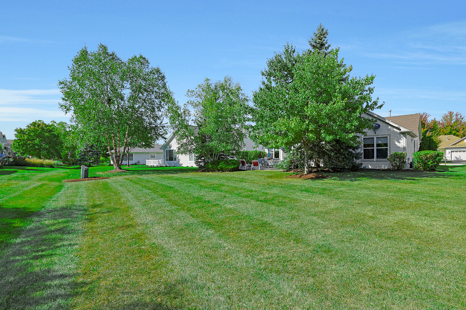 12961 West Bull Ridge Drive Huntley, IL 60142 - Photo 7 of 35 a view of green field with trees in the background