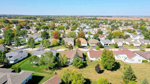 an aerial view of residential houses with outdoor space