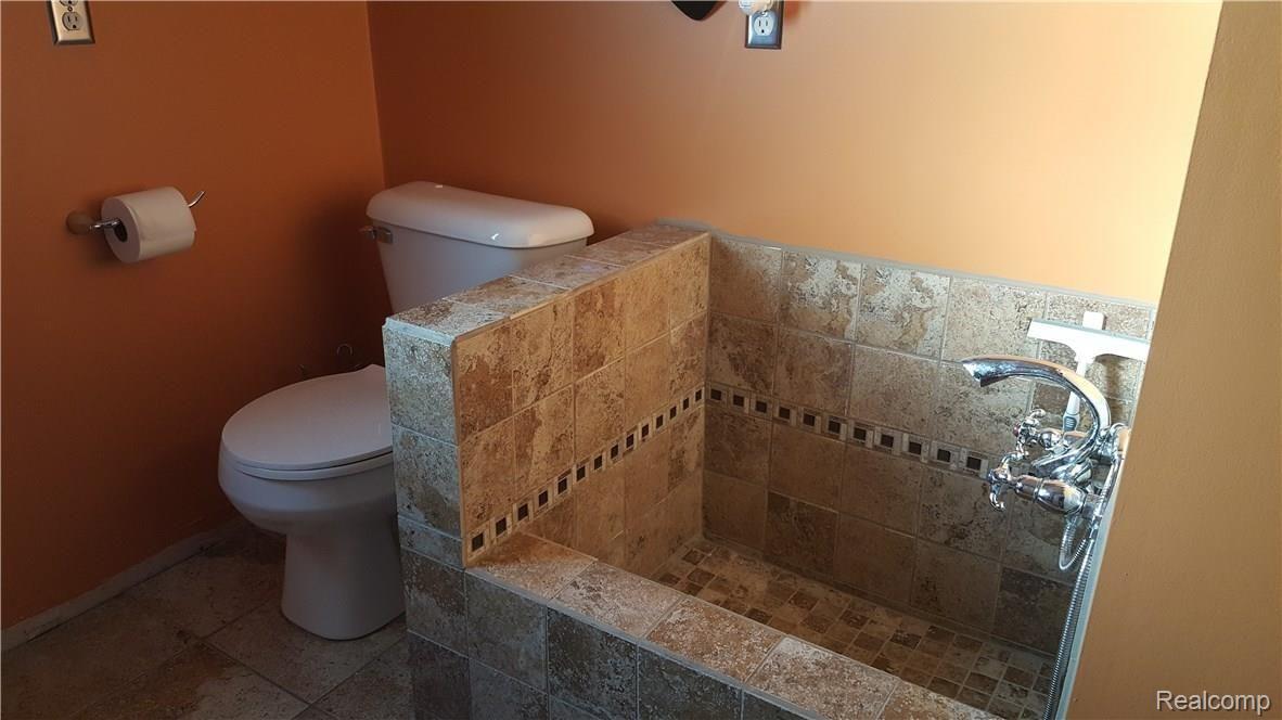 1452 Remsing Street Hartland, MI 48353 - Photo 11 of 24 Half bath on Entry with Knee Deep Sink