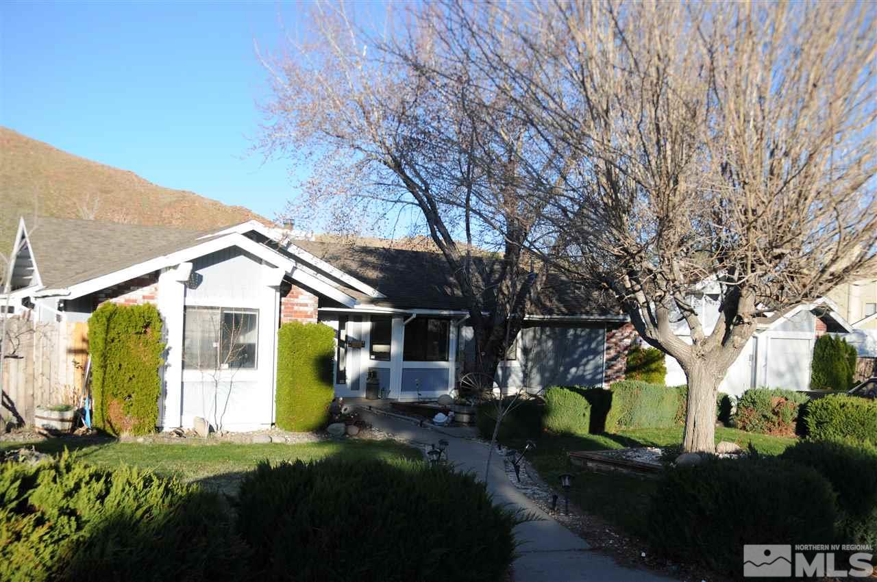 285 Gooseberry Drive Reno, NV 89523 - Photo 2 of 24 a front view of a house with a garden