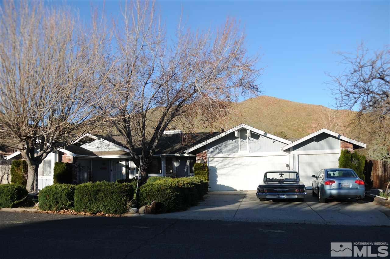 285 Gooseberry Drive Reno, NV 89523 - Photo 3 of 24 a view of a white house next to a road and yard