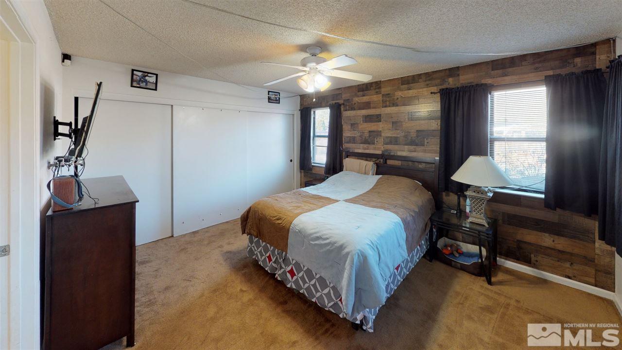 285 Gooseberry Drive Reno, NV 89523 - Photo 10 of 24 a bedroom with a bed and a mirror