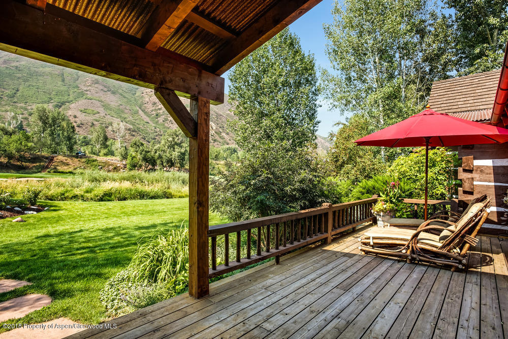 27 Altamira Ranch Road Basalt, CO 81621 - Photo 15 of 22 a view of balcony with wooden floor and outdoor seating