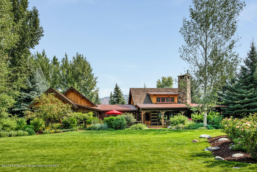 27 Altamira Ranch Road Basalt, CO 81621 - Photo 18 of 22 a view of a big house with a big yard and large trees