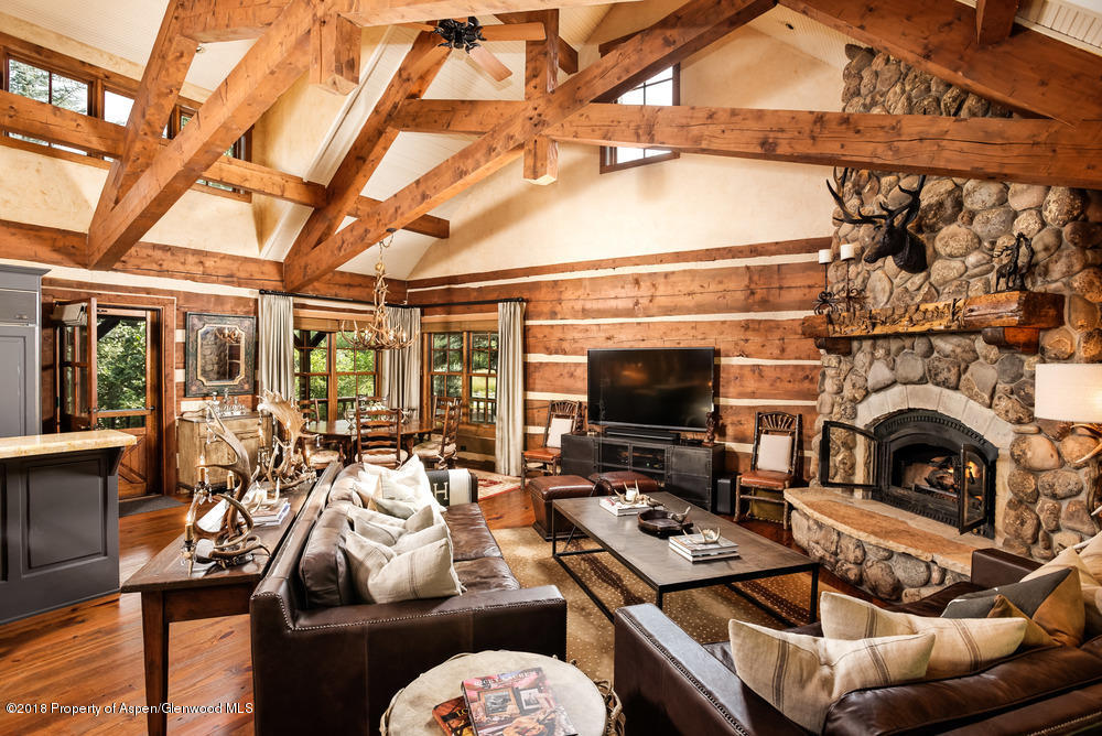 27 Altamira Ranch Road Basalt, CO 81621 - Photo 3 of 22 a living room with furniture a flat screen tv and a fireplace