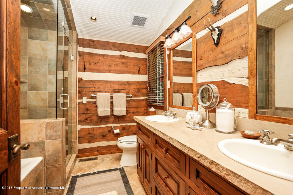 27 Altamira Ranch Road Basalt, CO 81621 - Photo 7 of 22 a bathroom with a double vanity sink mirror and shower