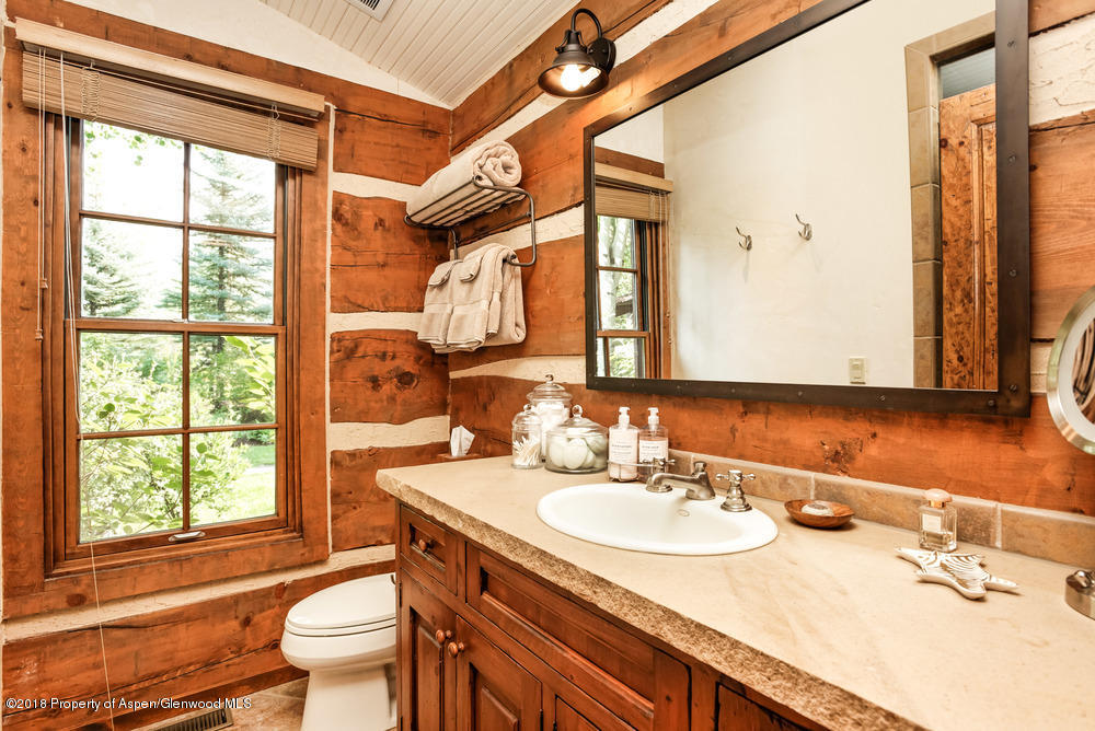 27 Altamira Ranch Road Basalt, CO 81621 - Photo 10 of 22 a bathroom with a granite countertop sink and a mirror