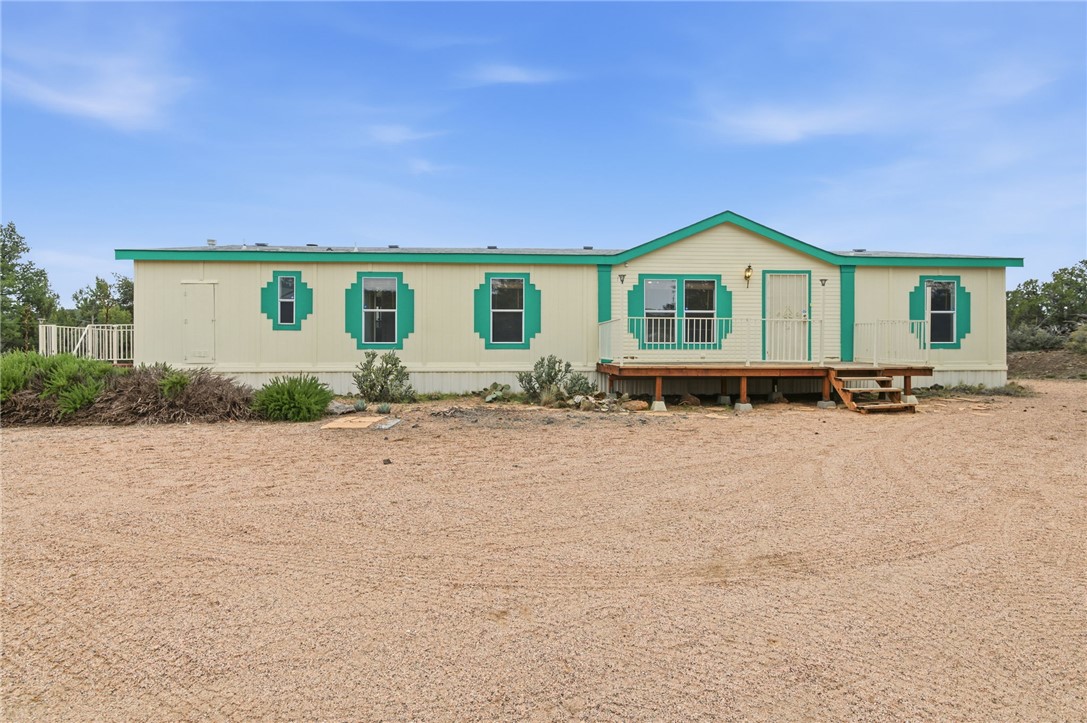 4619 North Lookout Canyon Road Kingman, AZ 86401 - Photo 1 of 50 a front view of a house with yard