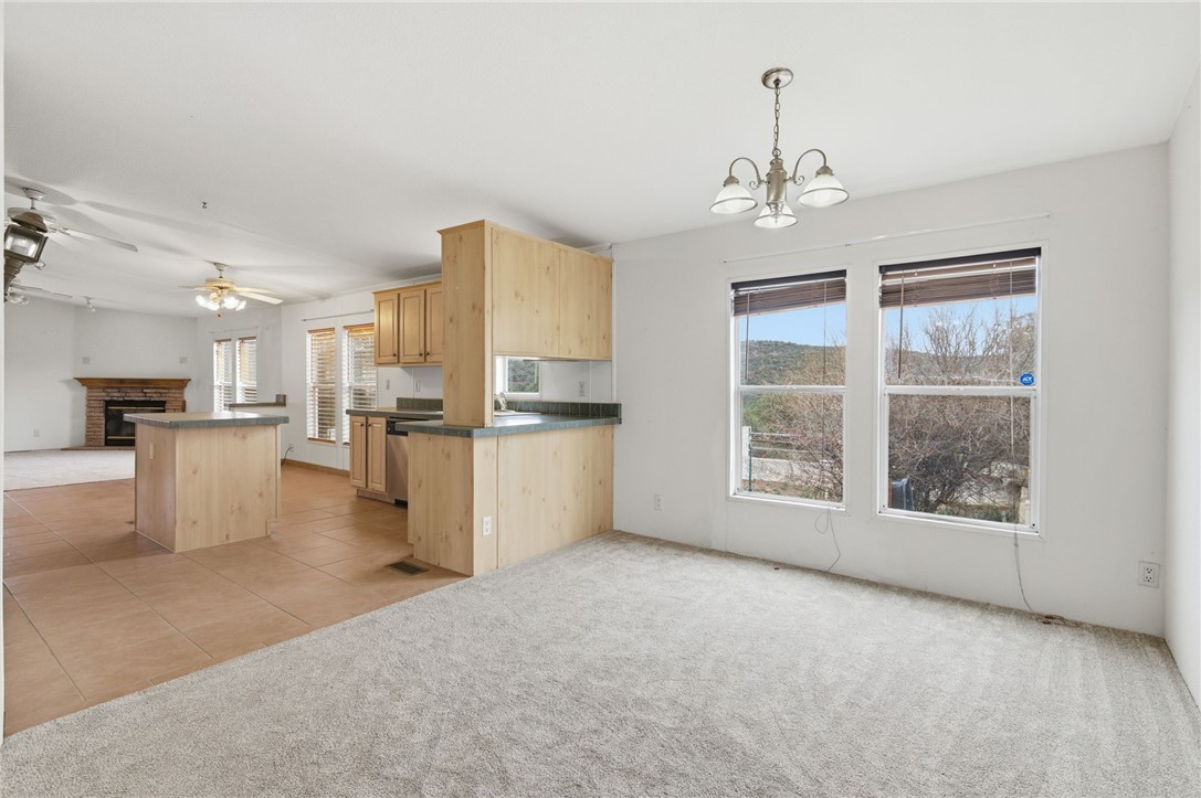 4619 North Lookout Canyon Road Kingman, AZ 86401 - Photo 11 of 50 a view of a kitchen with microwave and refrigerator