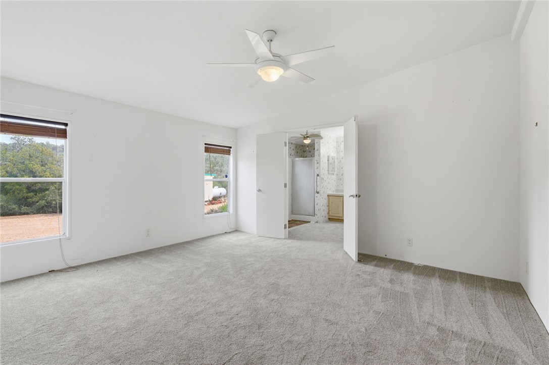 4619 North Lookout Canyon Road Kingman, AZ 86401 - Photo 16 of 50 an empty room with closet and windows