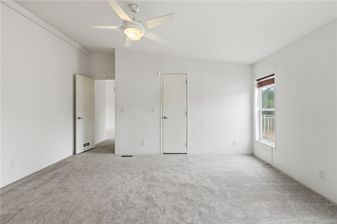 4619 North Lookout Canyon Road Kingman, AZ 86401 - Photo 17 of 50 an empty room with an entryway and fan