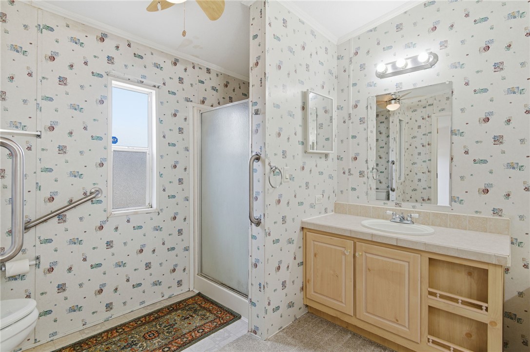 4619 North Lookout Canyon Road Kingman, AZ 86401 - Photo 19 of 50 a bathroom with a sink a vanity and a shower