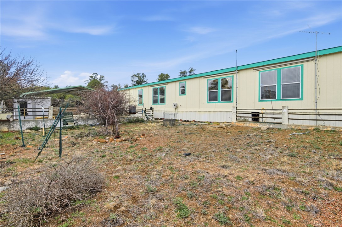 4619 North Lookout Canyon Road Kingman, AZ 86401 - Photo 34 of 50 a front view of a house with a yard