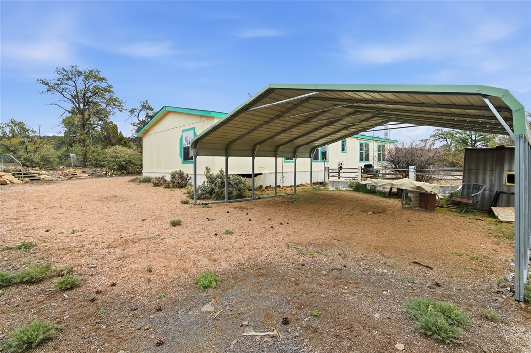 4619 North Lookout Canyon Road Kingman, AZ 86401 - Photo 6 of 50 a view of patio with a table and chairs under an umbrella