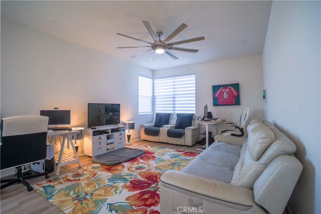 35323 Orchard Trail Fallbrook, CA 92028 - Photo 11 of 30 a living room with furniture a flat screen tv and a window