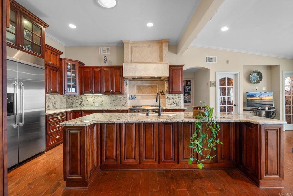 10310 Fuerte Drive La Mesa, CA 91941 - Photo 13 of 75 a kitchen with stainless steel appliances granite countertop a sink and a refrigerator
