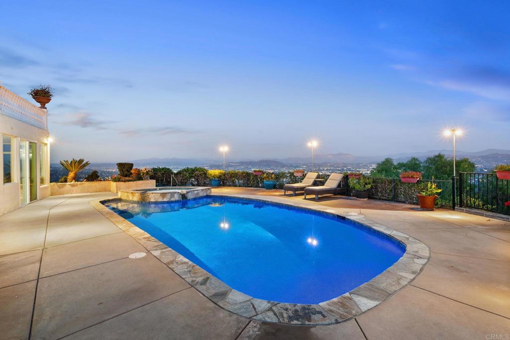 10310 Fuerte Drive La Mesa, CA 91941 - Photo 20 of 75 a view of a swimming pool with outdoor seating and plants