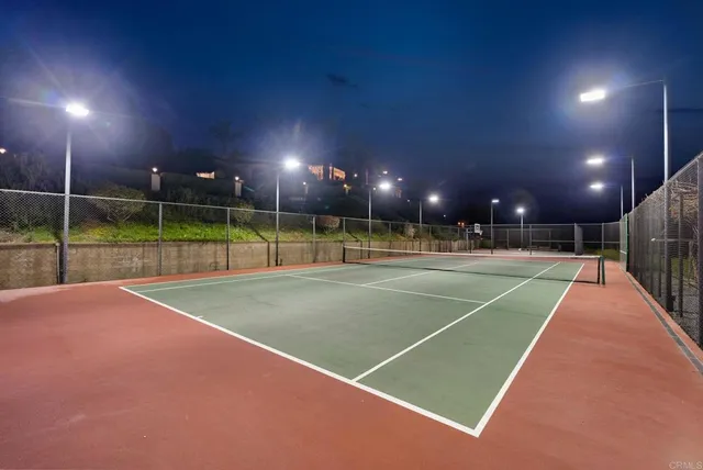 an aerial view of residential houses and outdoor space