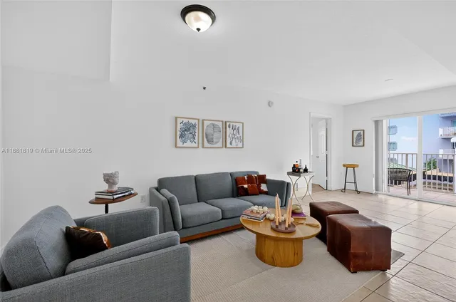 a living room with furniture and white walls