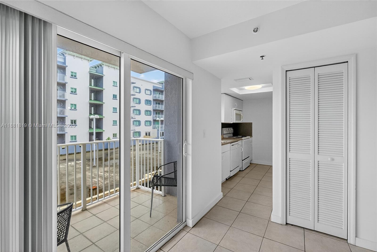 2475 Northwest 16th St Road, Unit 308 Miami, FL 33125 - Photo 13 of 25 a bathroom with a glass door shower and a sink