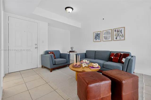 a living room with furniture and a table