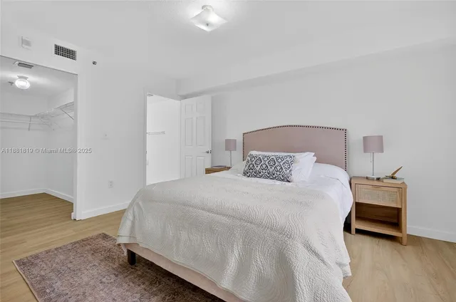 a bedroom with a bed and a table