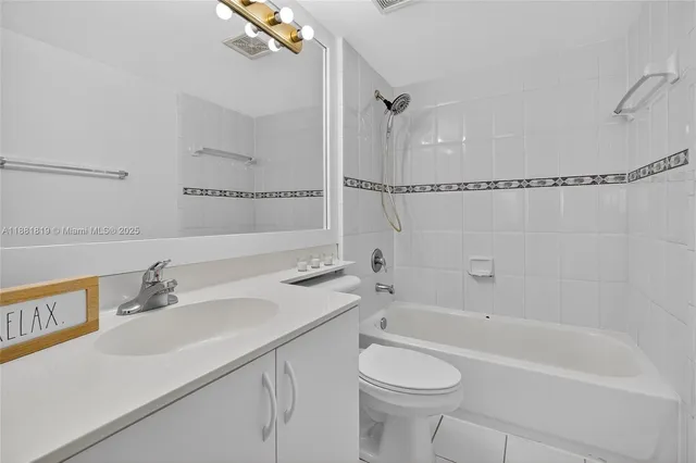 a bathroom with a sink a toilet and a bathtub