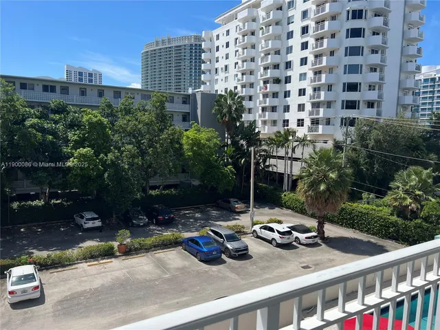 a dining room with furniture and a chandelier
