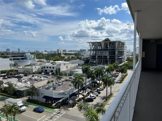 a view of a building with a tree