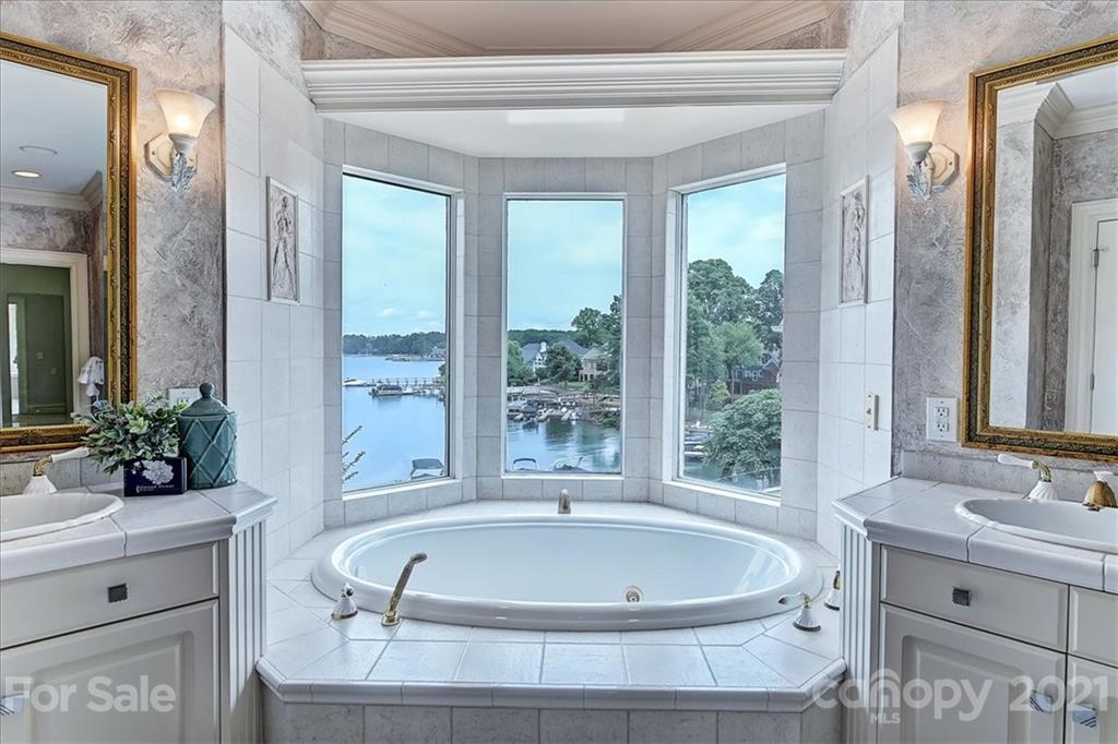 17519 Jetton Road, Unit 390 Cornelius, NC 28031 - Photo 12 of 31 a bath tub sitting in a bathroom next to a window
