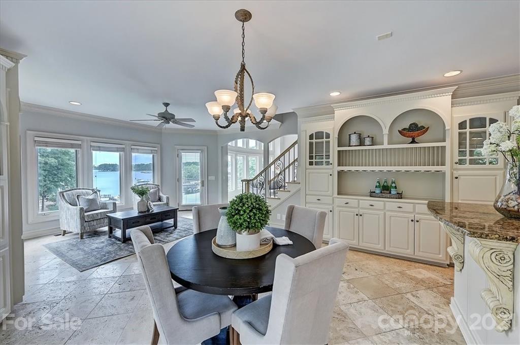 17519 Jetton Road, Unit 390 Cornelius, NC 28031 - Photo 14 of 31 a living room with furniture chandelier and a view of kitchen
