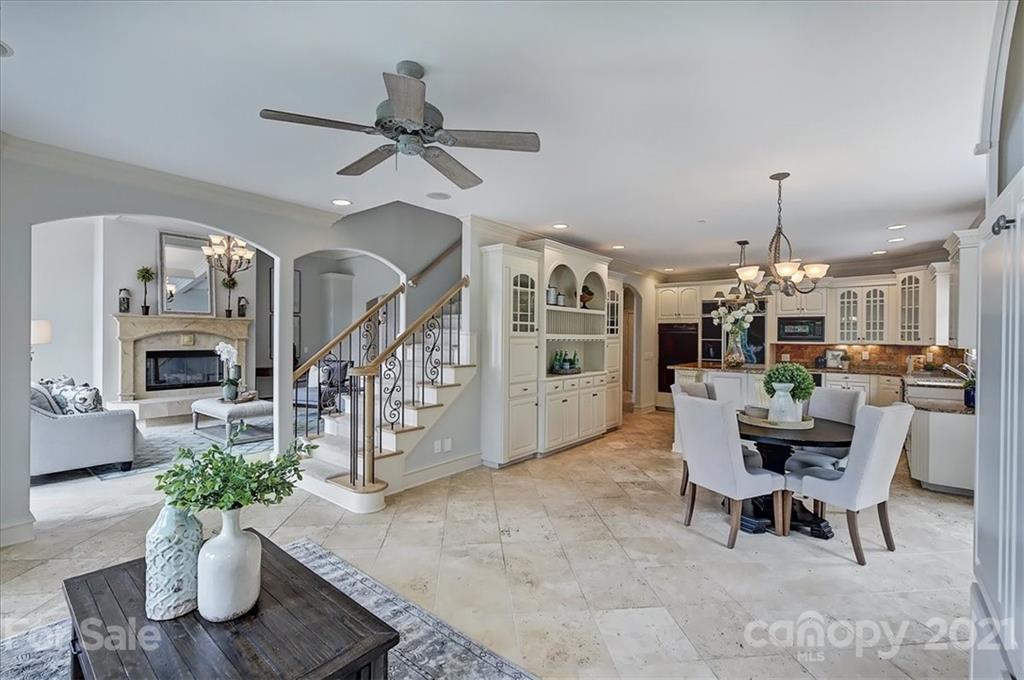 17519 Jetton Road, Unit 390 Cornelius, NC 28031 - Photo 16 of 31 a living room with furniture and a chandelier