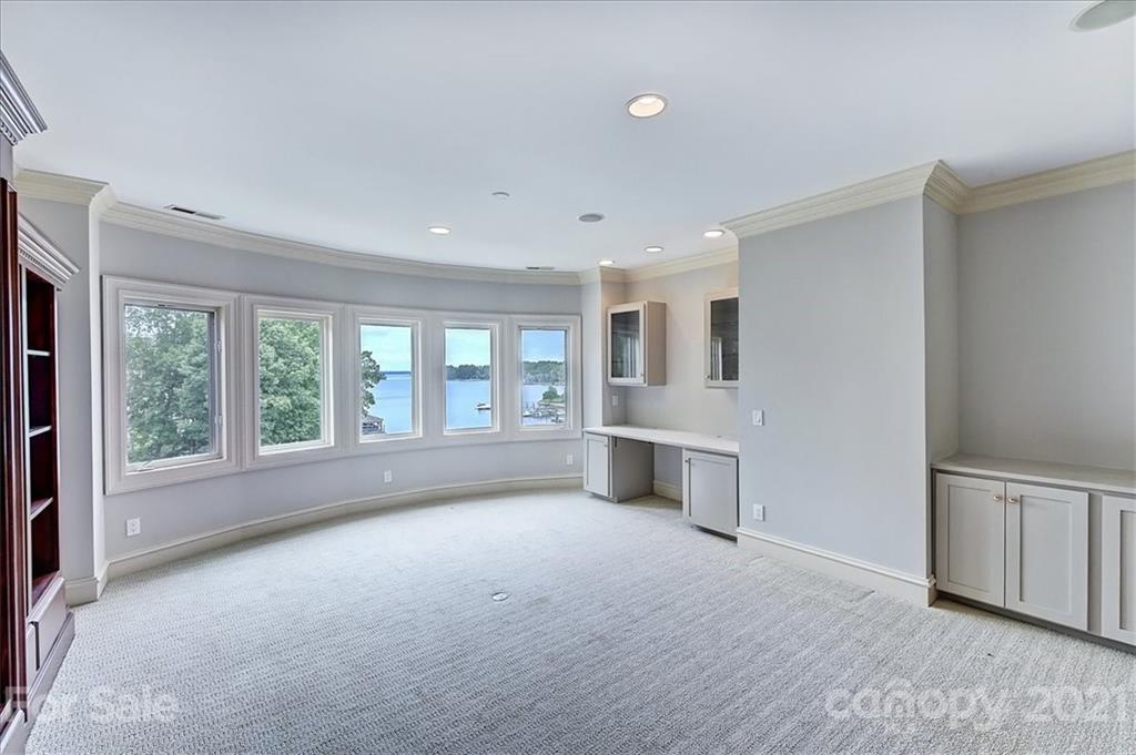 17519 Jetton Road, Unit 390 Cornelius, NC 28031 - Photo 19 of 31 a big room with windows and a view of kitchen