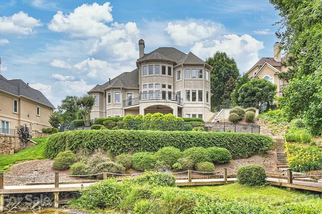 17519 Jetton Road, Unit 390 Cornelius, NC 28031 - Photo 29 of 31 a front view of a house with a yard