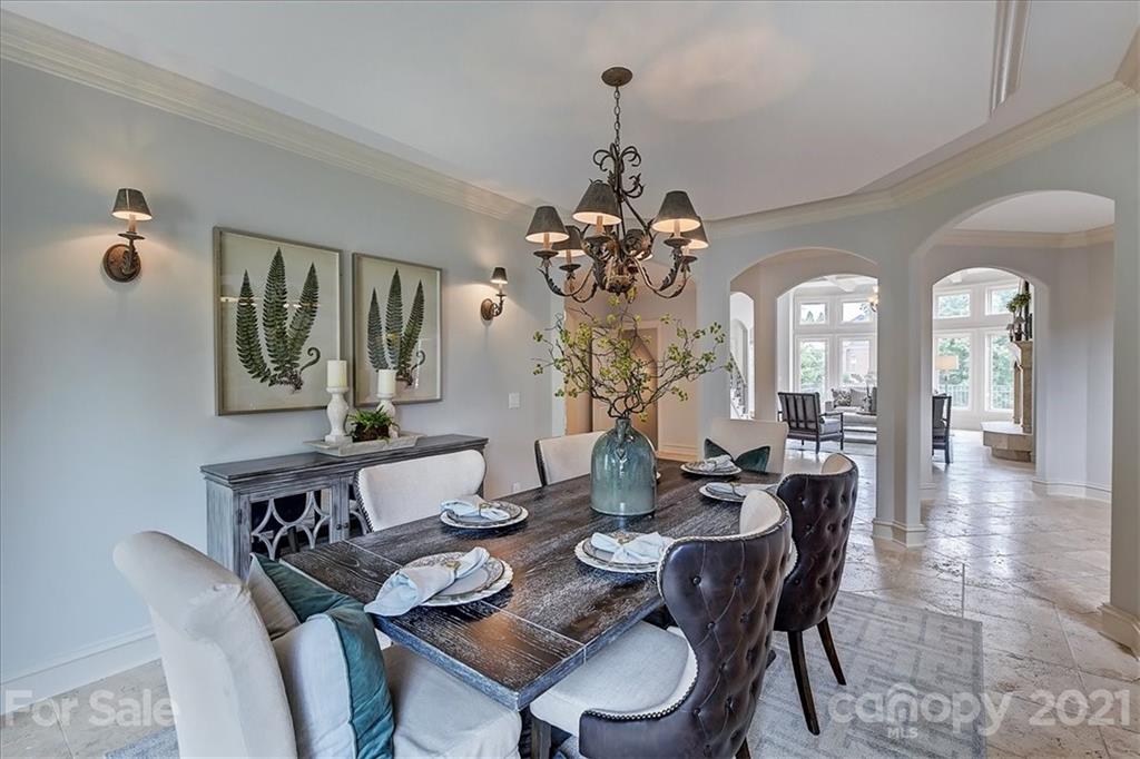 17519 Jetton Road, Unit 390 Cornelius, NC 28031 - Photo 6 of 31 a view of a dining room with furniture and chandelier